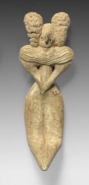 Figurine féminine en terre cuite, le visage...