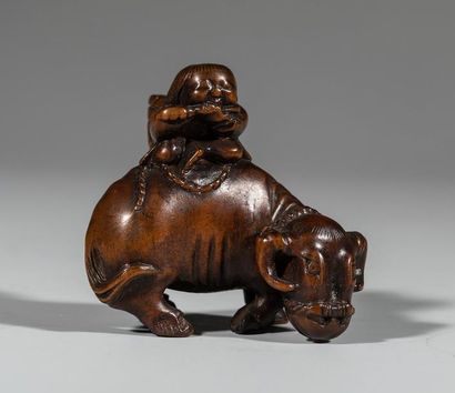 Netsuke en buis, représentant un enfant sur...