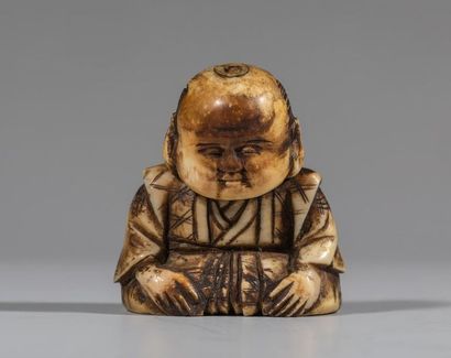 Netsuke en ivoire, représentant un enfant...