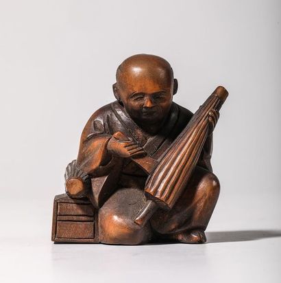 Netsuke en buis, représentant un fabriquant...