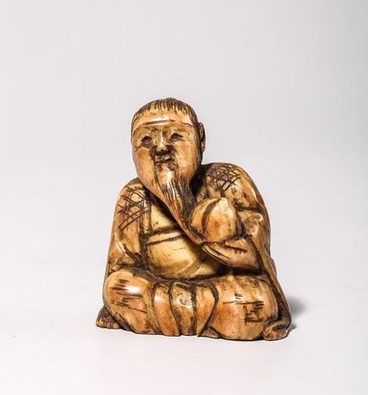 Netsuke en ivoire, représentant un homme...