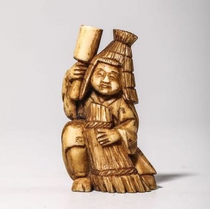 Netsuke en ivoire, représentant un paysan...