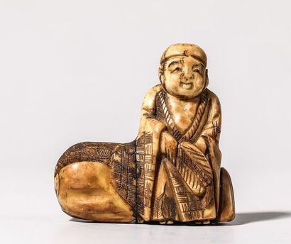 Netsuke en ivoire, représentant un paysan...