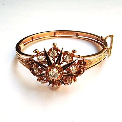 BRACELET jonc ouvrant en or jaune 18k (750°/°°)...