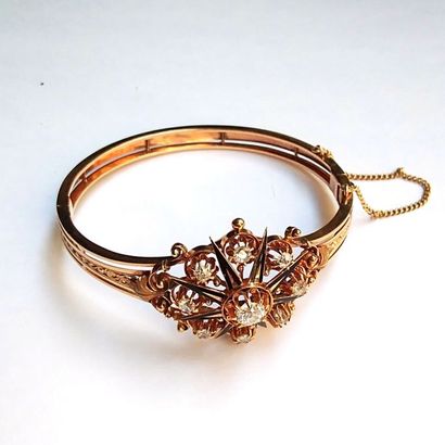 BRACELET jonc ouvrant en or jaune 18k (750°/°°)...