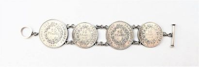 BRACELET en argent orné de 4 pièces de 50Fet...