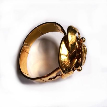 BRACELET en or jaune 18K (750/°°) articulé...