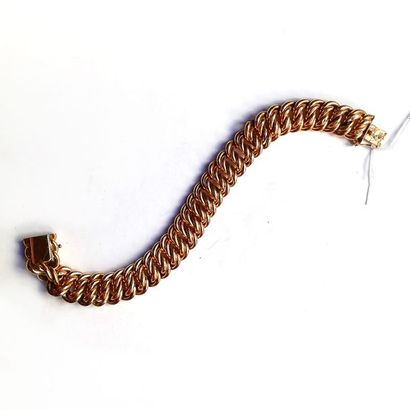 BRACELET GOURMETTE en or jaune 18K (750°/°°)....