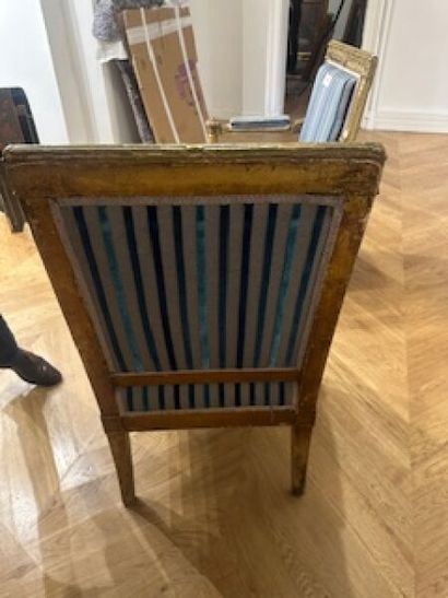 Pair of flat-back armchairs in carved and...