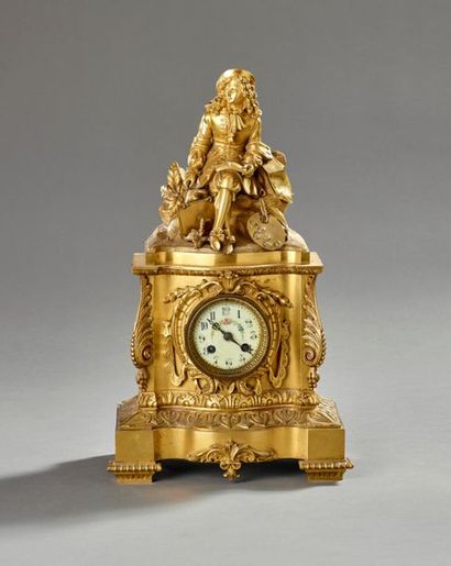 Pendule borne en bronze doré et ciselé.
La...
