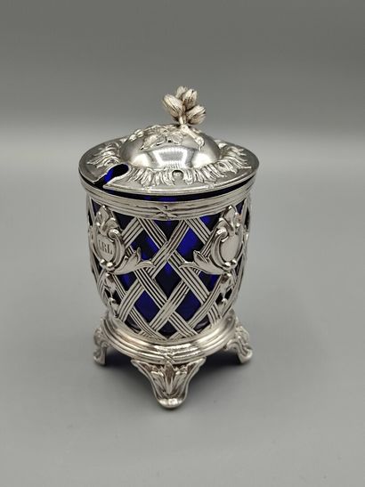 Silver mustard pot resting on four feet....