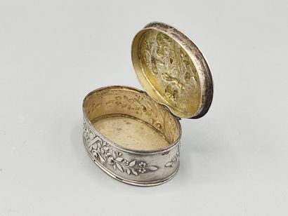 Oval silver box decorated on the lid with...