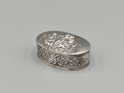 Oval silver box decorated on the lid with...