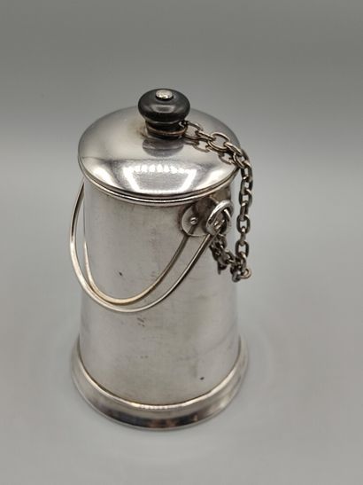 Silver milk jug with a handle.

Lid attached...