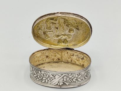 Oval silver box decorated on the lid with...