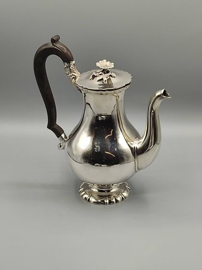 Silver coffee pot.

Rests on a base contours...