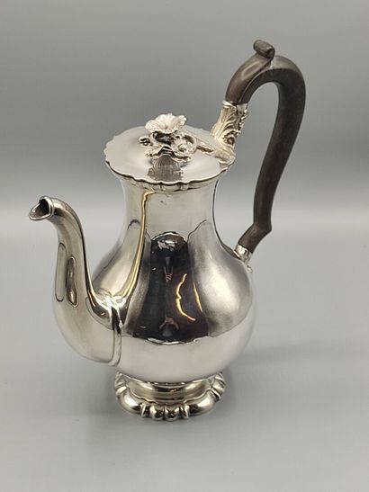 Silver coffee pot.

Rests on a base contours...