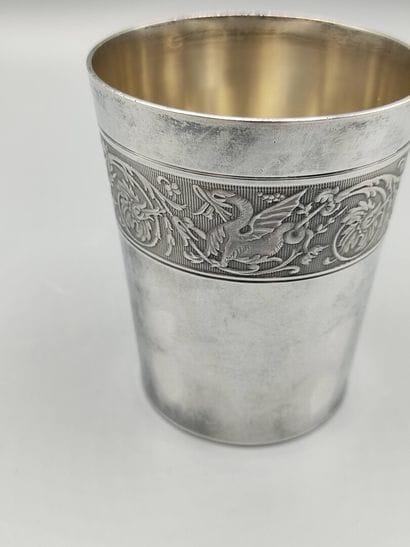 Silver tumbler of plain model. 

Large frieze...