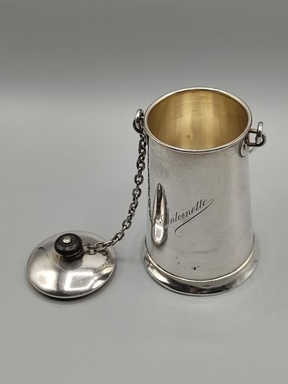 Silver milk jug with a handle.

Lid attached...