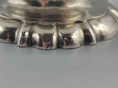 Silver coffee pot.

Rests on a base contours...