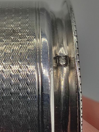 Silver napkin ring with guilloche decoration

Cartouche...