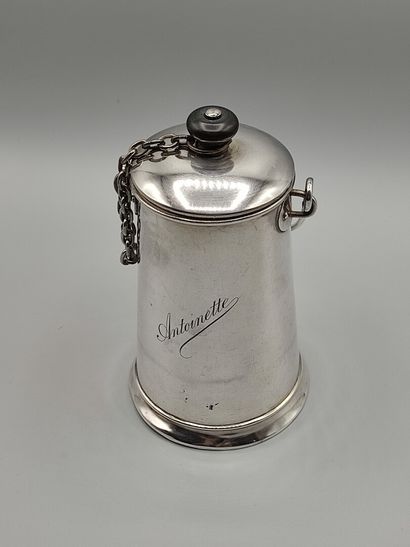 Silver milk jug with a handle.

Lid attached...