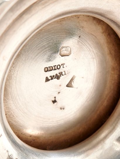 Silver coffee pot.

Rests on a base contours...