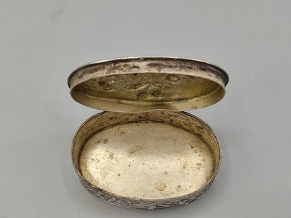 Oval silver box decorated on the lid with...