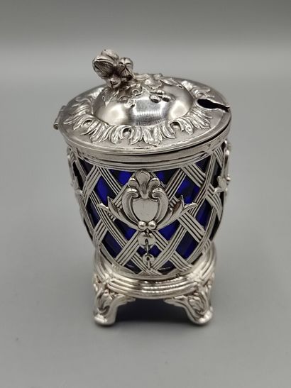 Silver mustard pot resting on four feet....
