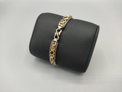 Yellow gold and silver bracelet with geometrical...
