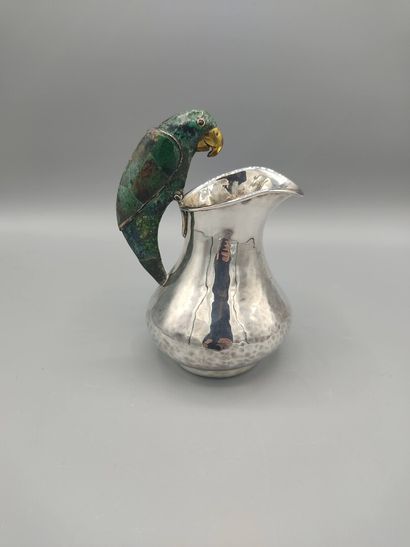 Hammered silver pitcher with a parrot shape...