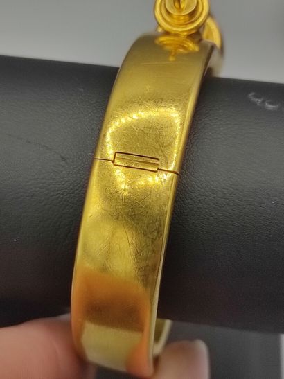 Rigid bracelet in 18KT gold set with a turquoise...