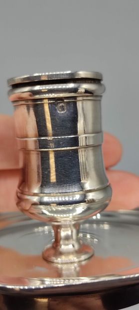 BOIN TABURET 

Candlestick with hand resting...