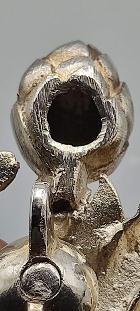 Pair of decorative silver elements (melted...