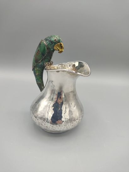 Hammered silver pitcher with a parrot shape...