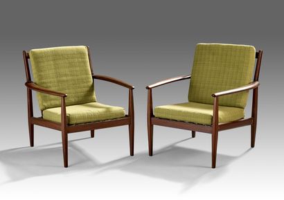 Pair of large teak armchairs.

Flared armrests.

Set...