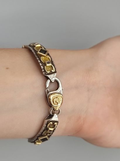 Yellow gold and silver bracelet with geometrical...
