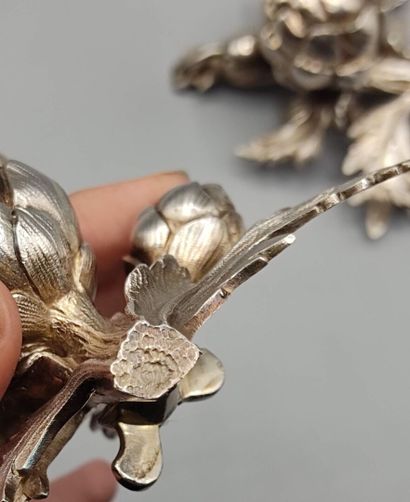 Pair of decorative silver elements (melted...