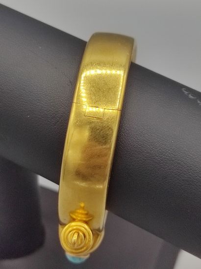 Rigid bracelet in 18KT gold set with a turquoise...