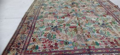 
Grand tapis noué main à décor d'animaux,...