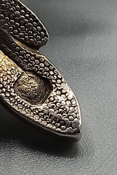 Pair of decorative silver elements (melted...