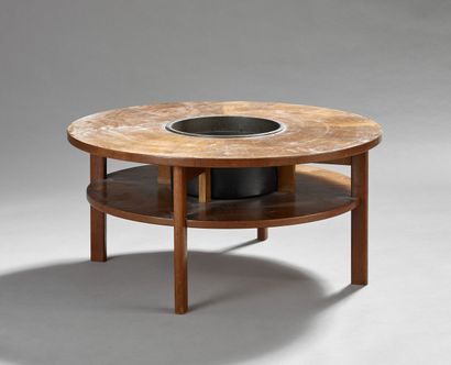 Coffee table with double circular teak top.

The...