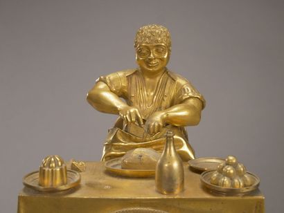 Curieuse pendule en bronze doré et ciselé...
