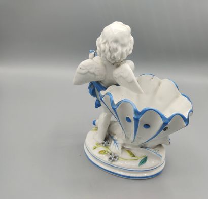 Vide poche figurant un angelot jouant de...
