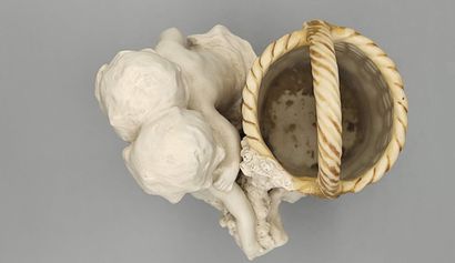 AMPHORA.

Bouquetière en biscuit et porcelaine...
