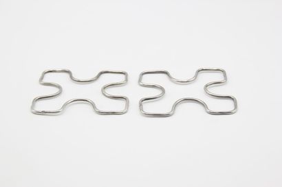Pair of silver trivets or bottles.

Minerva...