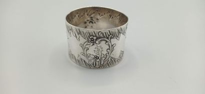 Silver napkin ring decorated with foliage...