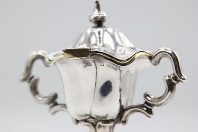 Mustard pot in silver resting on a quadripod...