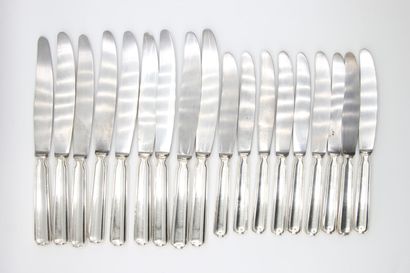 Double set of knives with silver handles...