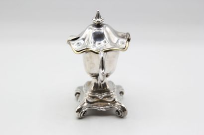 Mustard pot in silver resting on a quadripod...